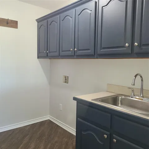 a bathroom with a sink and cabinets