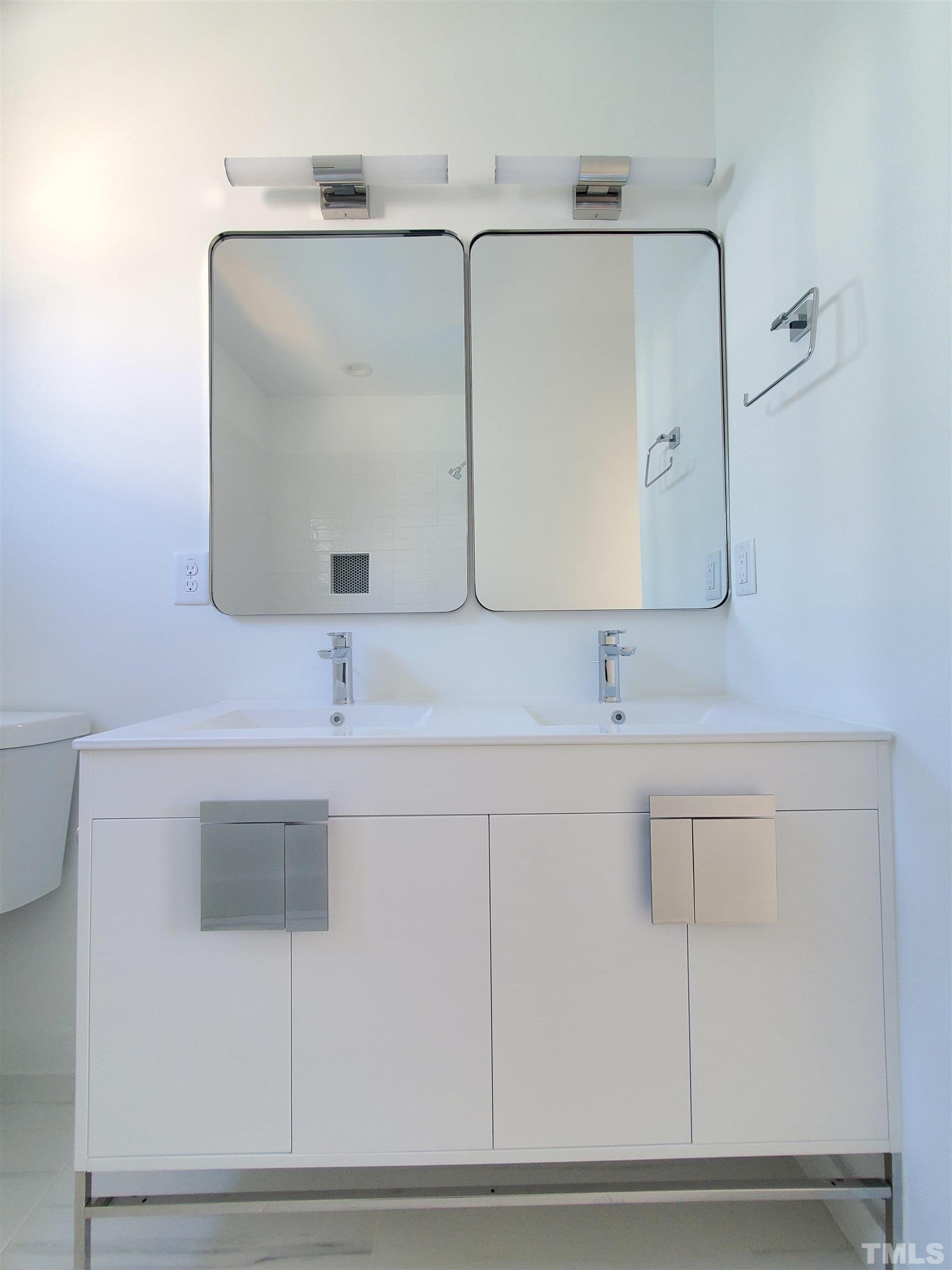 221 Bledsoe Avenue Raleigh, NC 27601 - Photo 18 of 28 a bathroom with a sink and a mirror