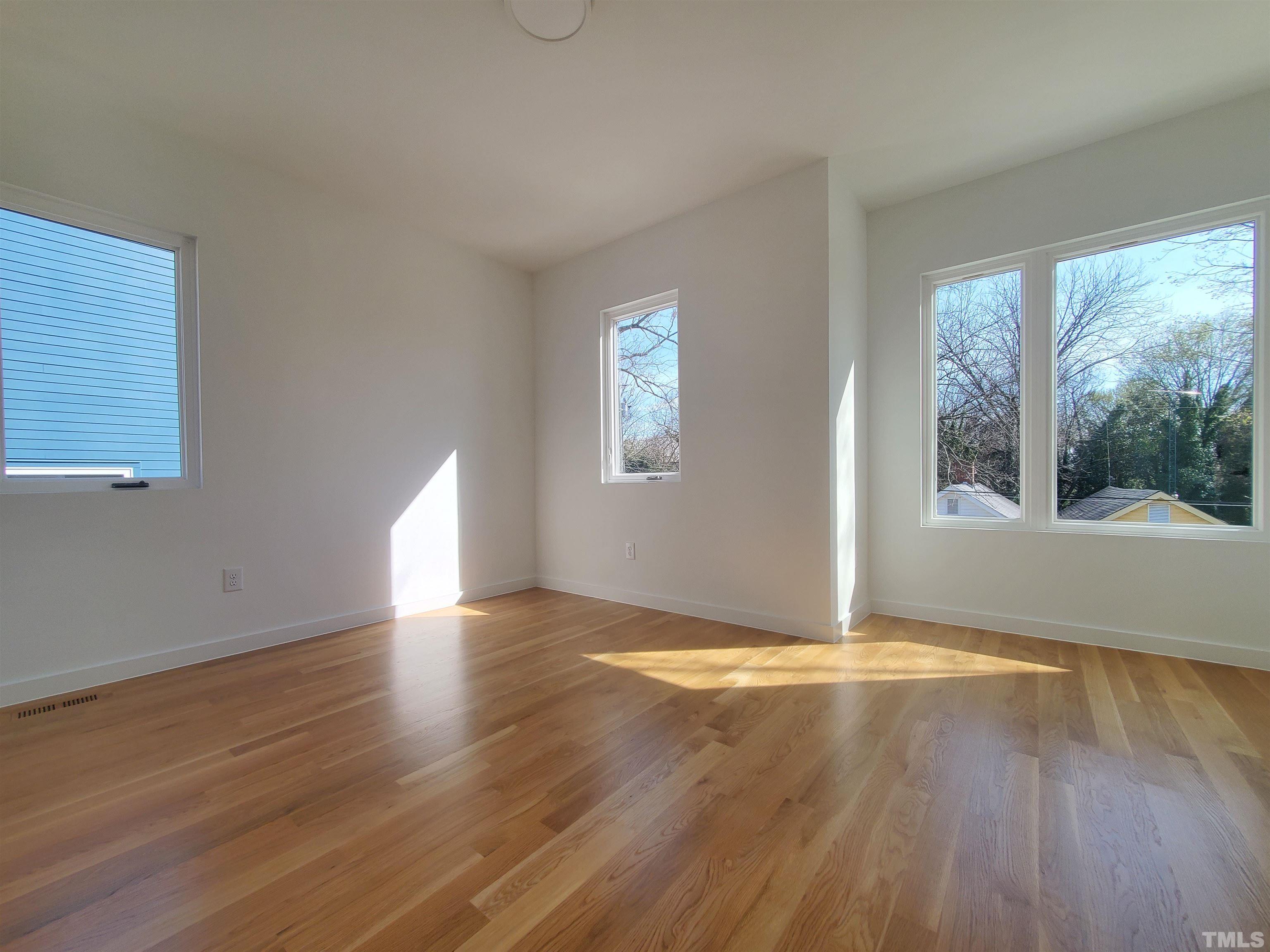 221 Bledsoe Avenue Raleigh, NC 27601 - Photo 21 of 28 a view of empty room with wooden floor and fan