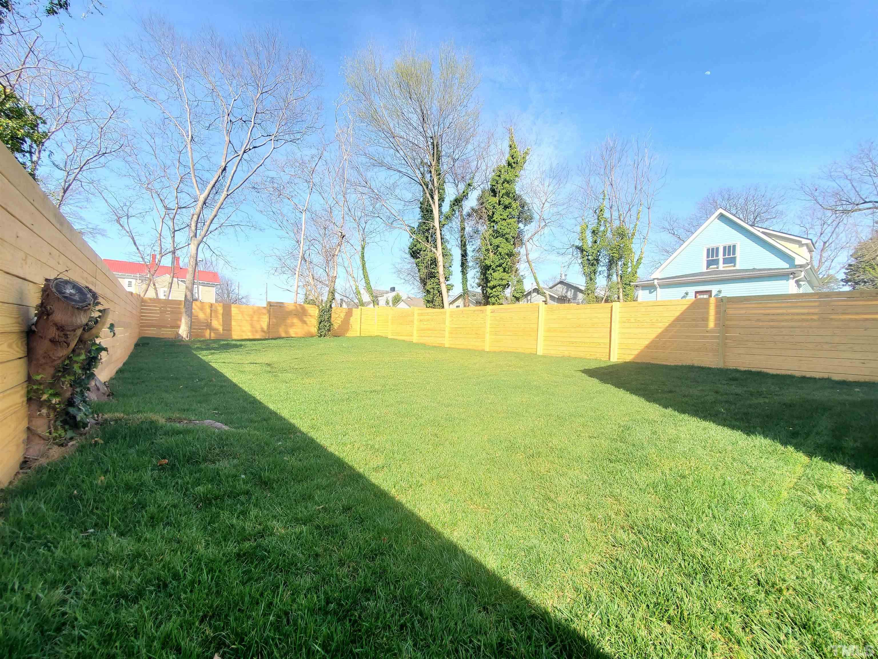 221 Bledsoe Avenue Raleigh, NC 27601 - Photo 28 of 28 a view of a house with a yard and swimming pool