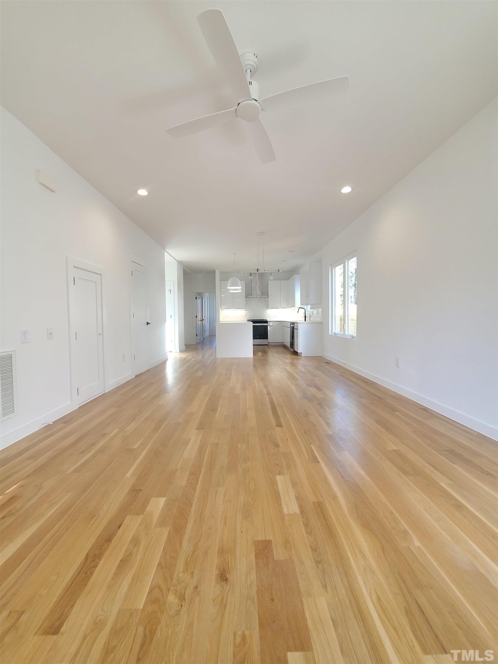 221 Bledsoe Avenue Raleigh, NC 27601 - Photo 3 of 28 a view of empty room with wooden floor and fan