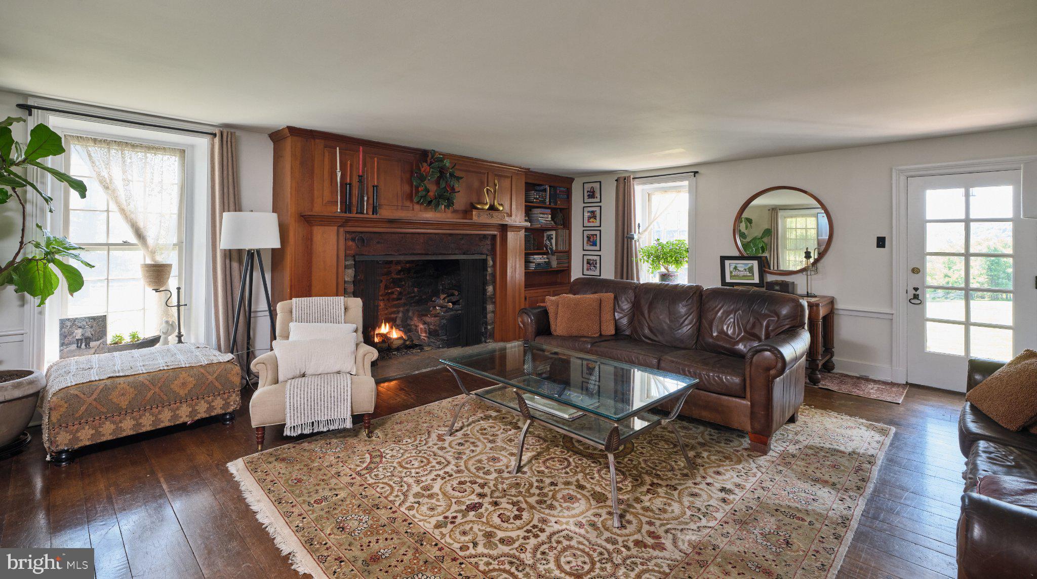 765 Swamp Road Newtown, PA 18940 - Photo 5 of 37 a living room with furniture and a fireplace