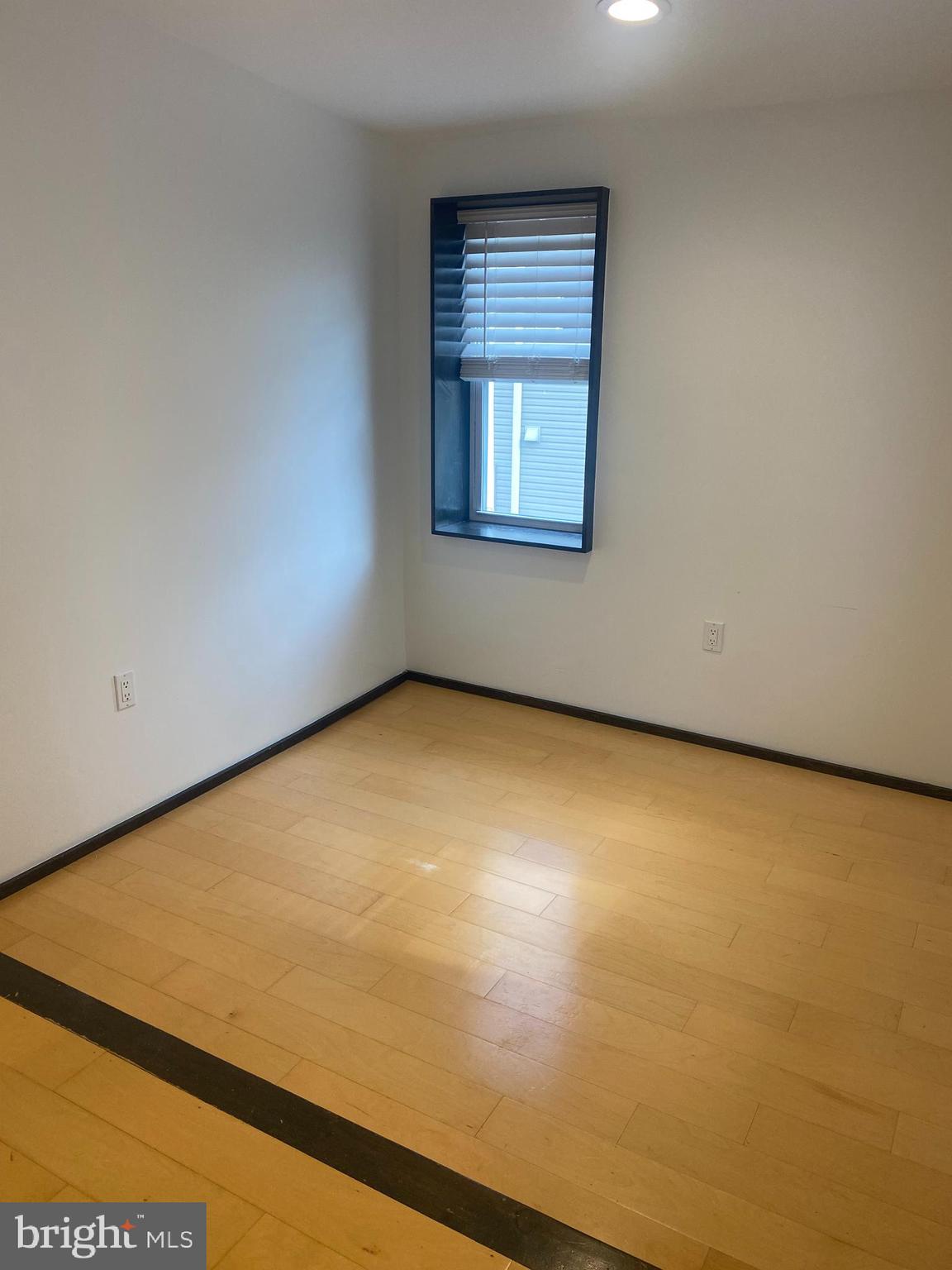 2641 Tulip Street Philadelphia, PA 19125 - Photo 15 of 37 an empty room with a window