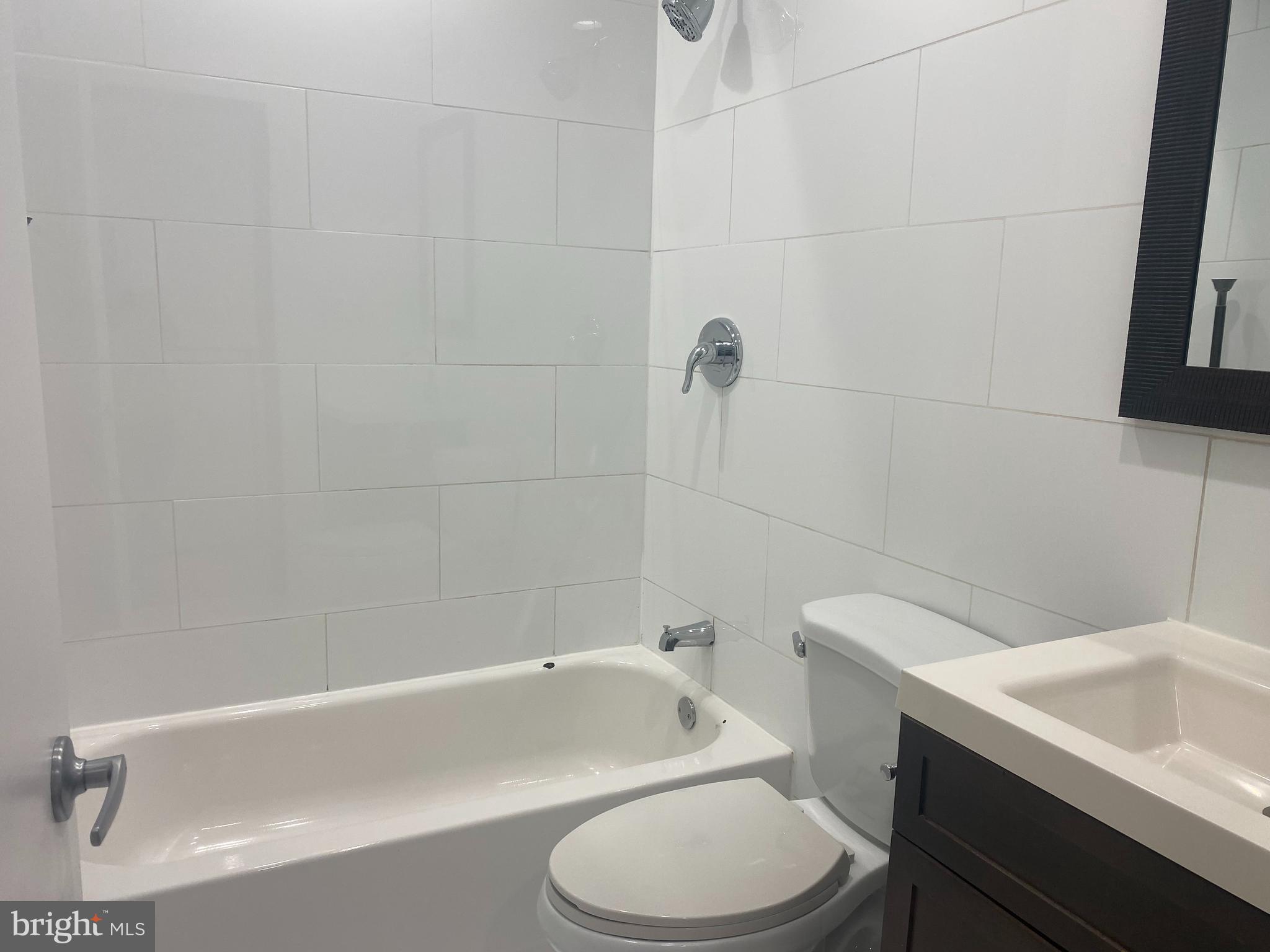 2641 Tulip Street Philadelphia, PA 19125 - Photo 19 of 37 a bathroom with a sink a toilet and bathtub