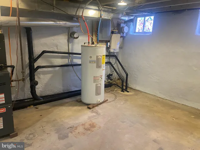 a view of storage and utility room with washer and dryer