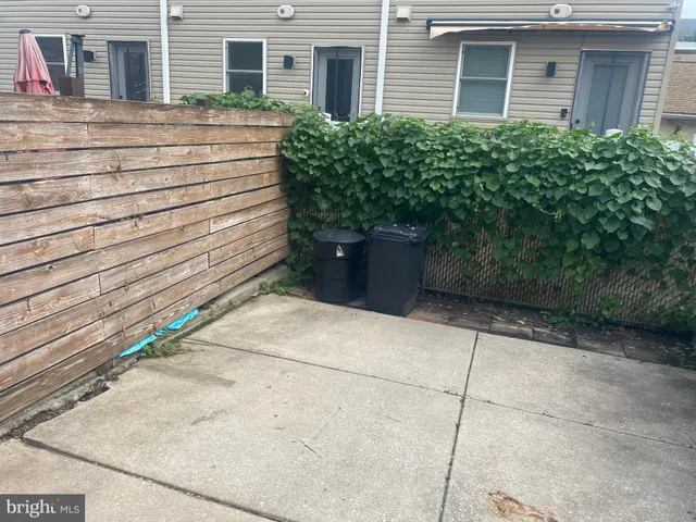a view of a brick building with many windows