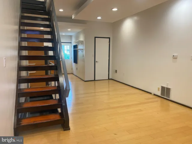 a view of an empty room with stairs