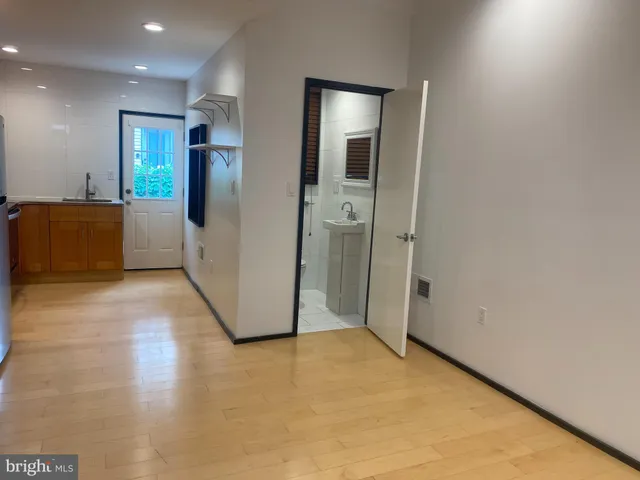 a kitchen with stainless steel appliances a refrigerator a stove a microwave a sink and a cabinets