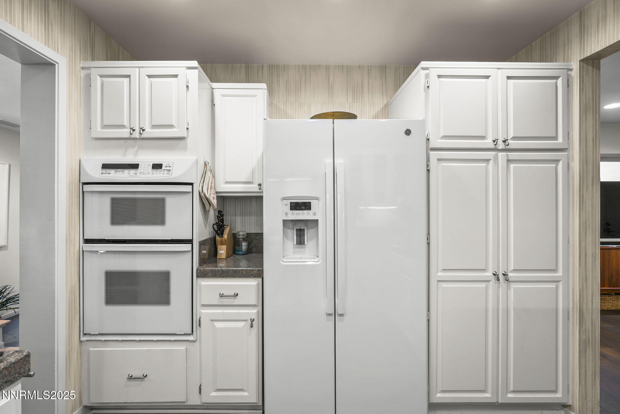 6302 Green Ranch Road Reno, NV 89519 - Photo 19 of 26 a white refrigerator freezer and a stove sitting inside of a kitchen