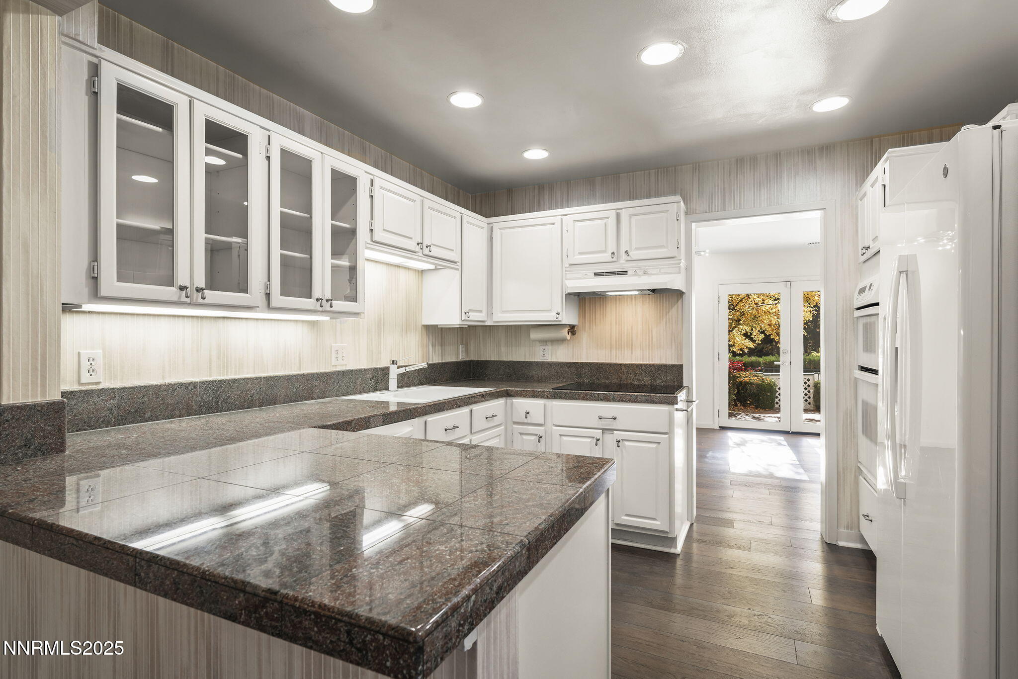 6302 Green Ranch Road Reno, NV 89519 - Photo 9 of 26 a kitchen with stainless steel appliances granite countertop a refrigerator a sink and a stove