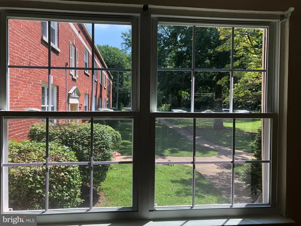 a kitchen with a sink and a mirror