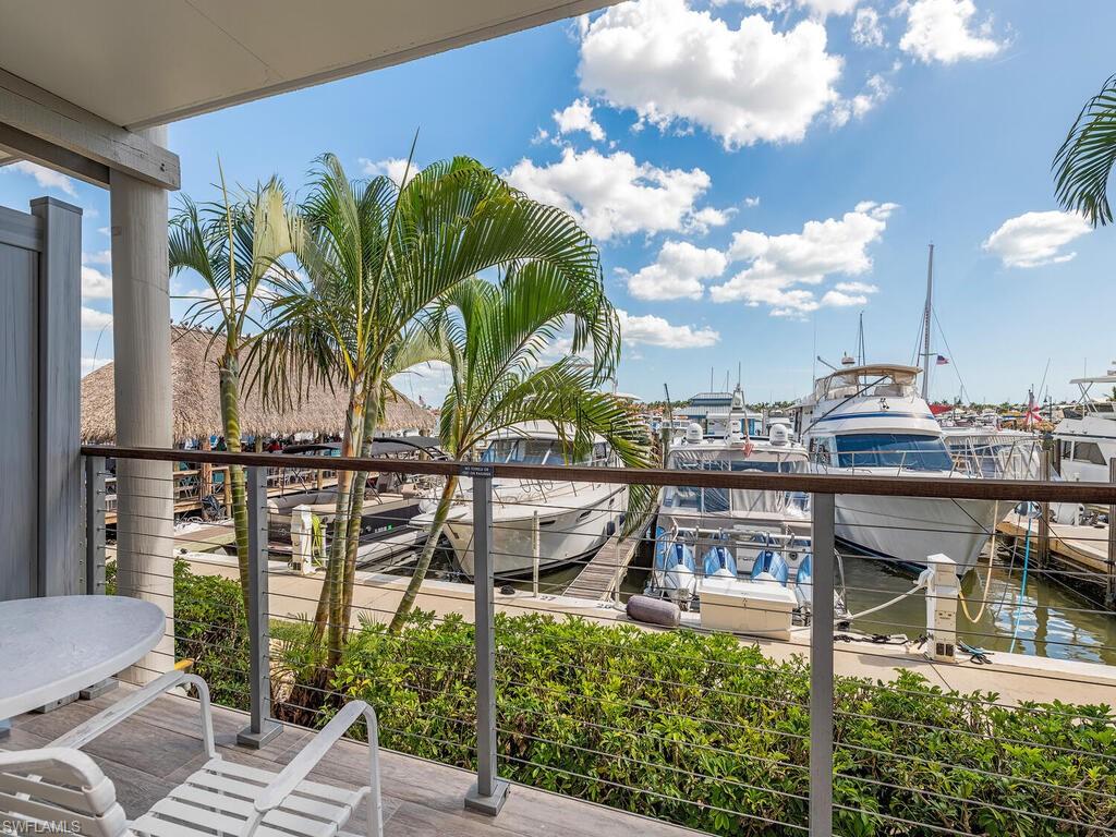 Undisclosed Address Naples, FL 34102 - Photo 1 of 1 a view of a chairs and table in patio