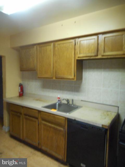 4640 Marble Hall Road Baltimore, MD 21239 - Photo 8 of 26 a kitchen with a sink and cabinets