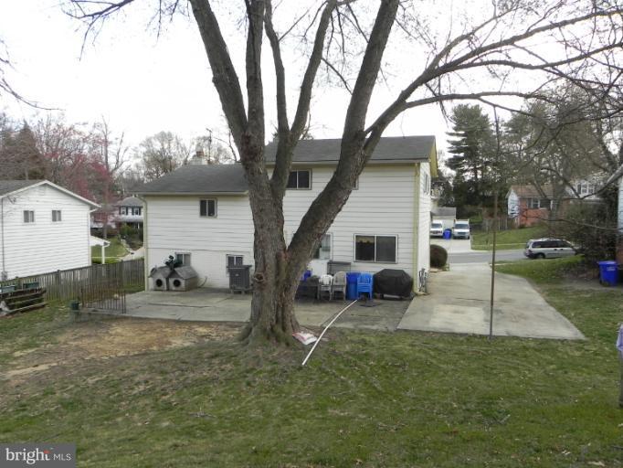 13006 Tamarack Road Silver Spring, MD 20904 - Photo 14 of 21 a view of a house with backyard and a tree