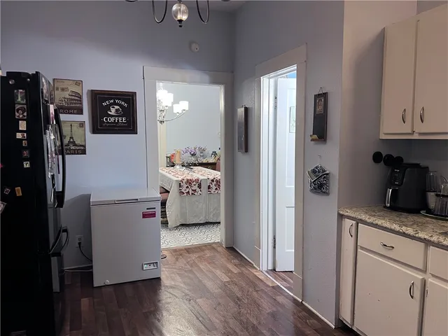 a kitchen with stainless steel appliances granite countertop a refrigerator and a stove top oven
