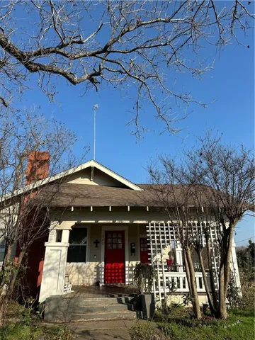 a view of a chairs and table in the patio