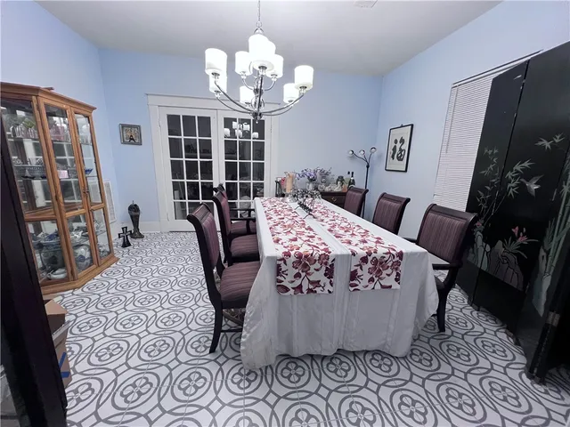 a bed room with furniture and a chandelier