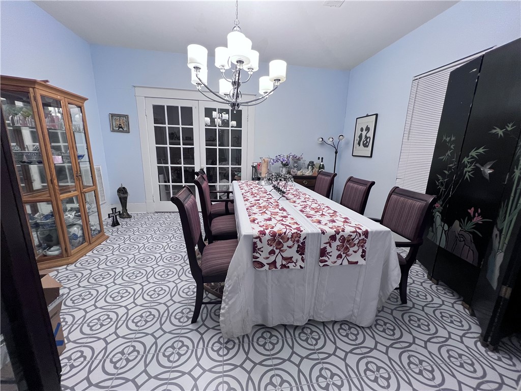 800 Ward Street Marlin, TX 76661 - Photo 5 of 22 a bed room with furniture and a chandelier