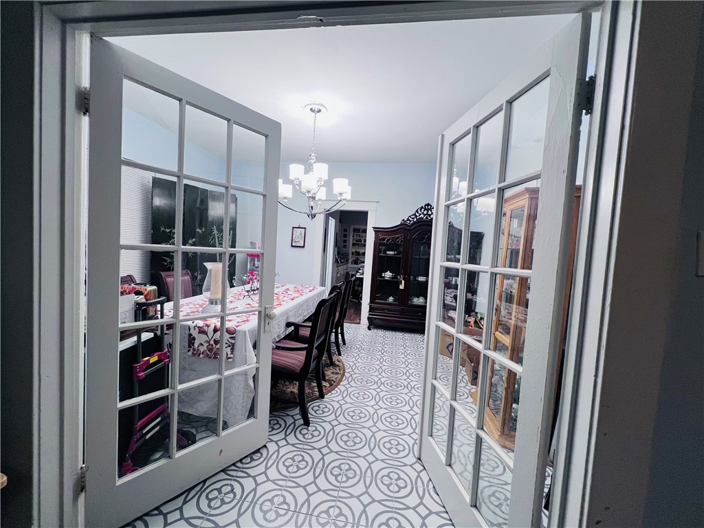800 Ward Street Marlin, TX 76661 - Photo 7 of 22 a room with furniture a rug and a chandelier