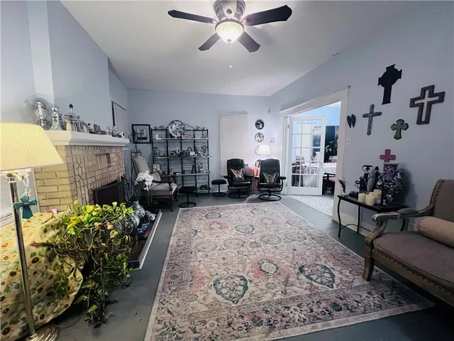 a living room with furniture fireplace and a chandelier