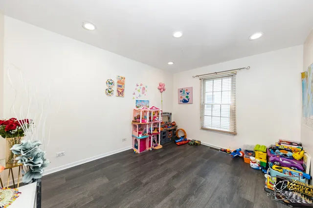 a room with toys and wooden floor