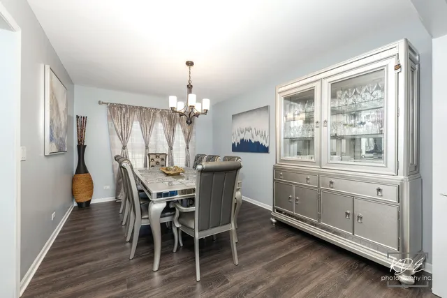 a view of a dining room with furniture and window
