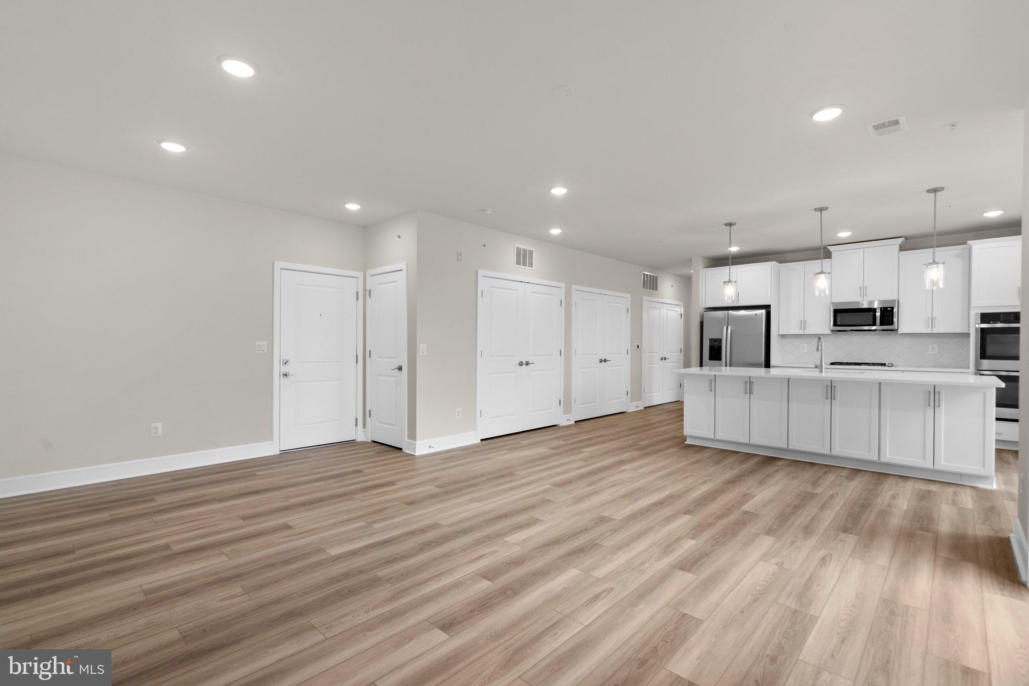 a view of kitchen with wooden floor and window