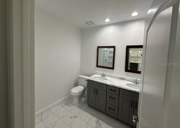 a bathroom with a shower and a glass door