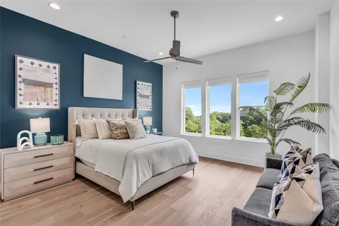 a spacious bedroom with a large bed and a window