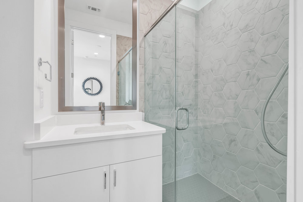 2505 Bluebonnet Lane, Unit 5 Austin, TX 78704 - Photo 26 of 35 a bathroom with a sink and a mirror