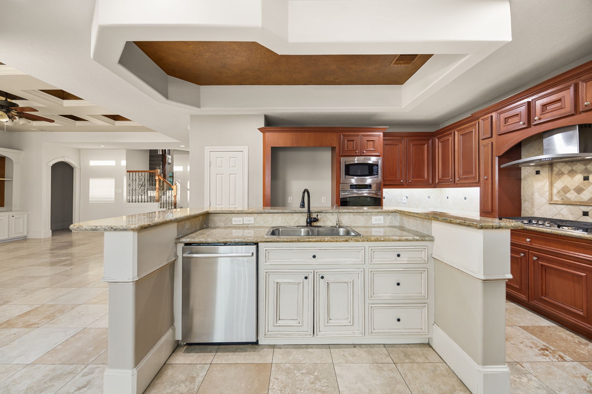 18921 Mountain Spring Drive Spring, TX 77379 - Photo 17 of 40 a kitchen with a sink stove and cabinets
