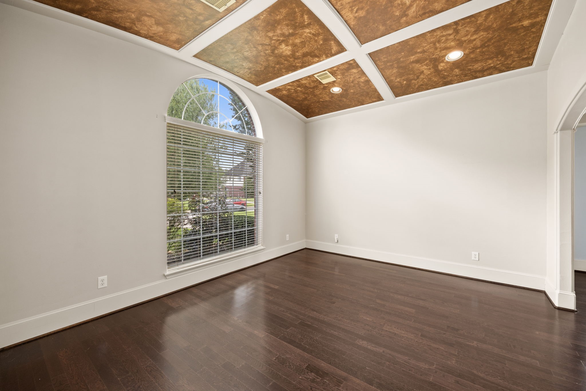 18921 Mountain Spring Drive Spring, TX 77379 - Photo 20 of 40 an empty room with wooden floor and windows