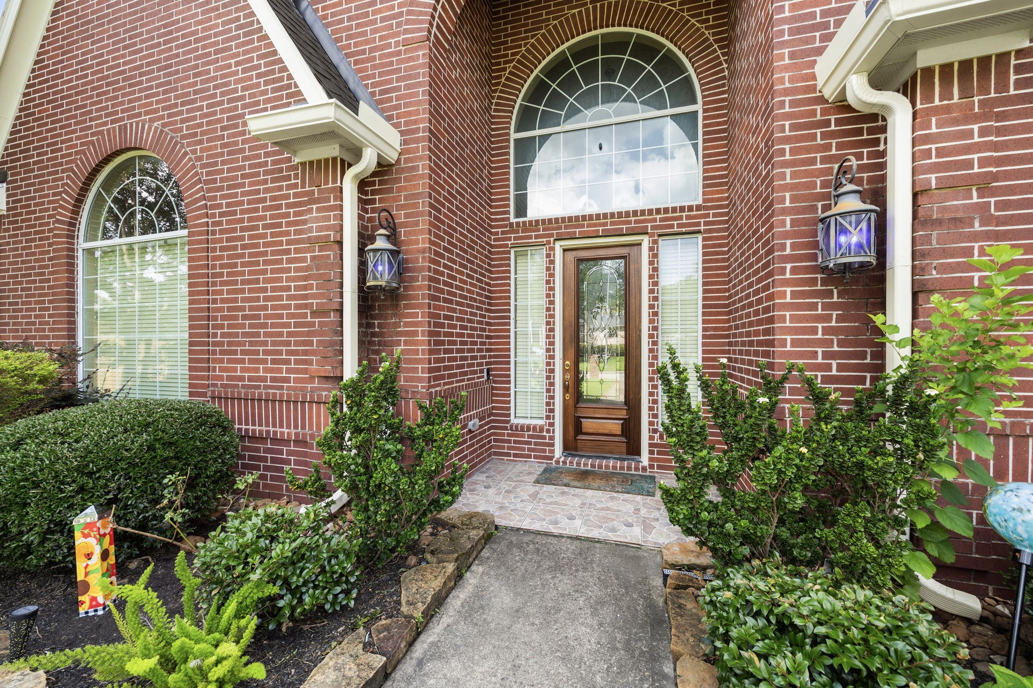 18921 Mountain Spring Drive Spring, TX 77379 - Photo 2 of 40 a front view of a house with a garden