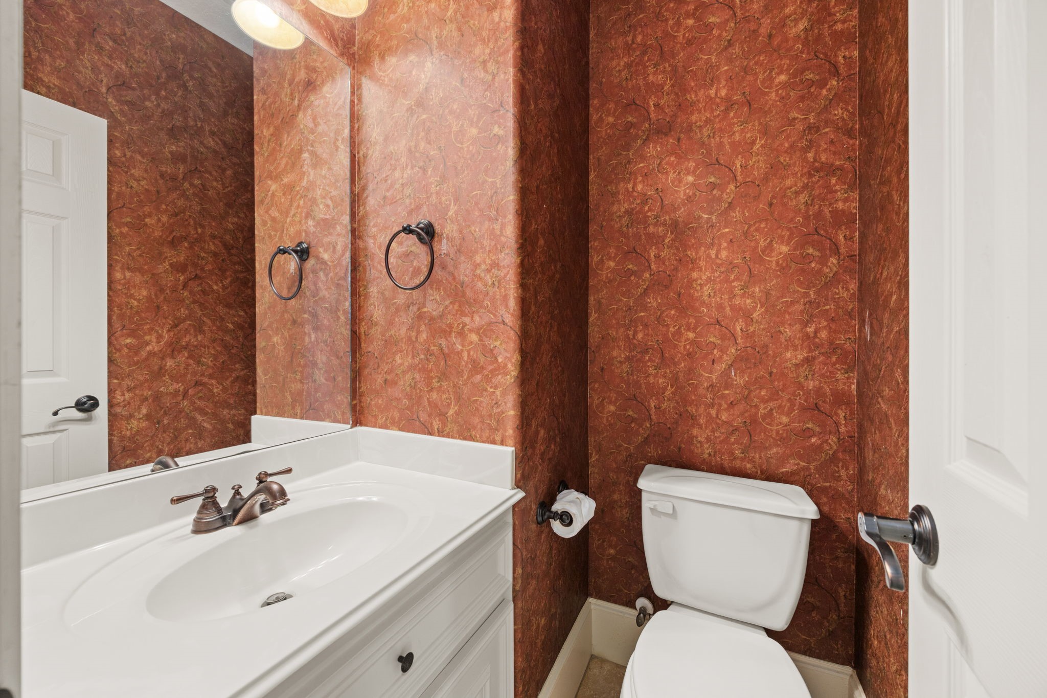 18921 Mountain Spring Drive Spring, TX 77379 - Photo 30 of 40 a bathroom with a toilet sink and mirror