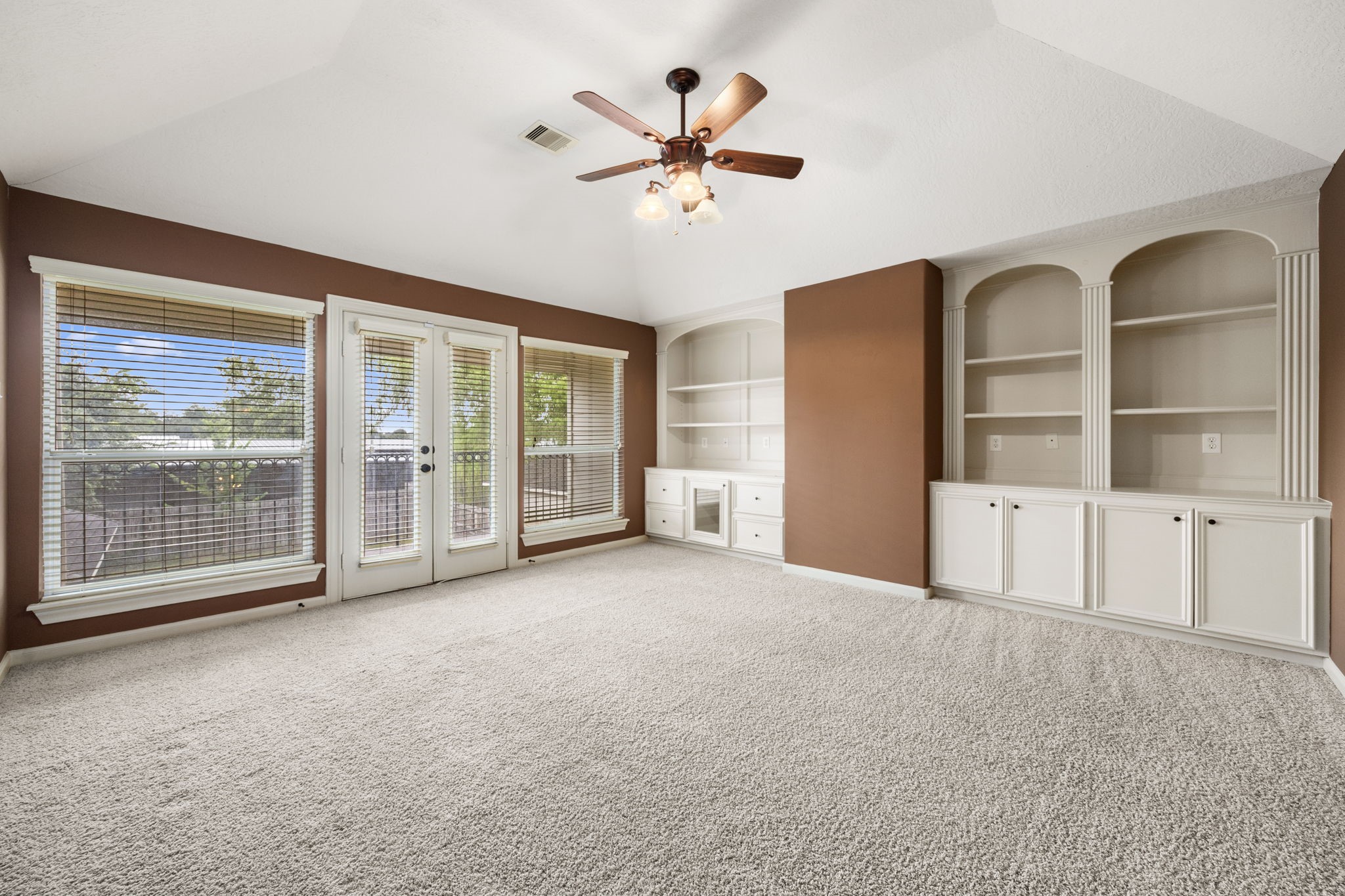 18921 Mountain Spring Drive Spring, TX 77379 - Photo 32 of 40 a view of an empty room with cabinet and a large window