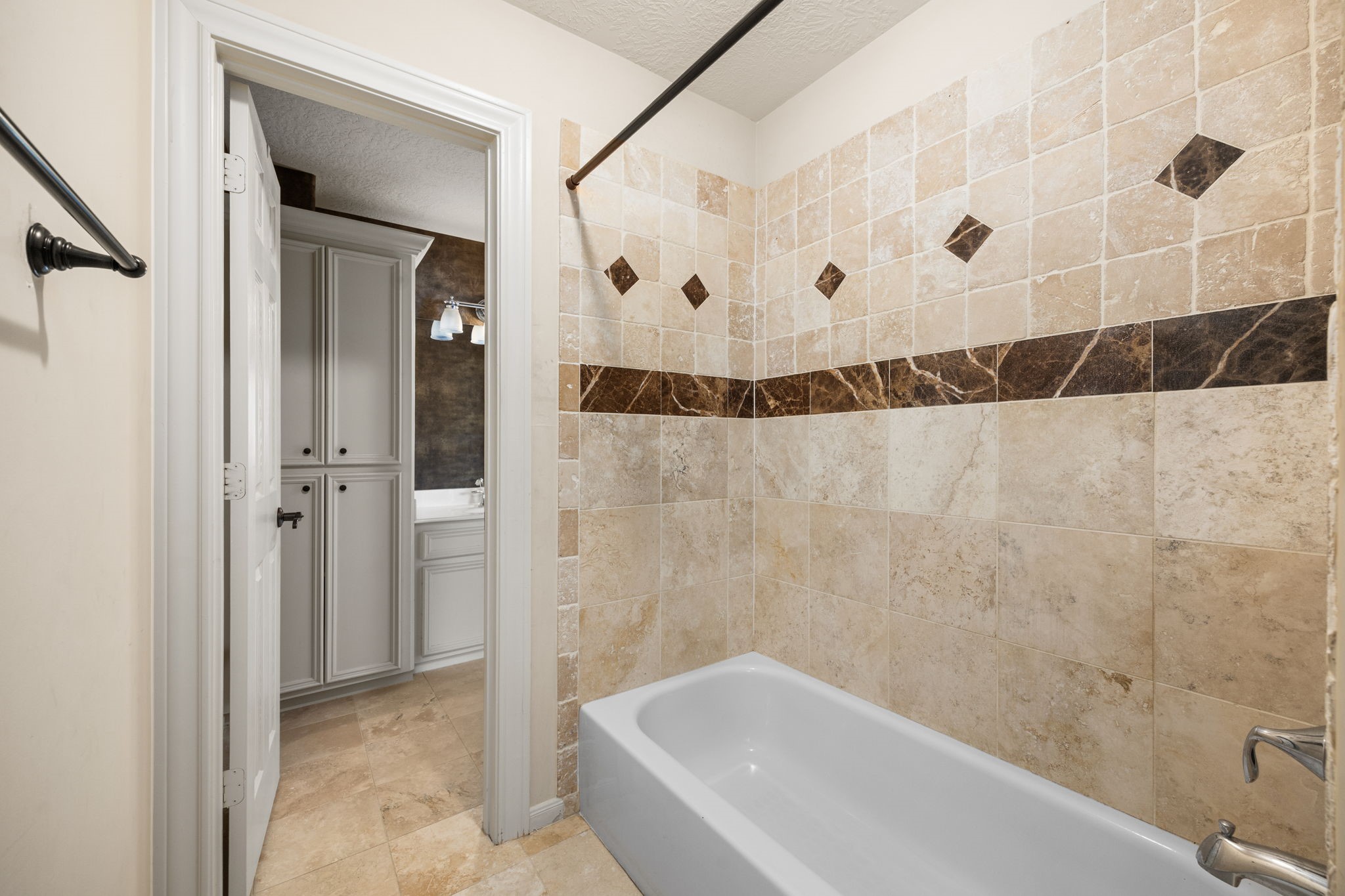 18921 Mountain Spring Drive Spring, TX 77379 - Photo 35 of 40 a bathroom with a bathtub and shower