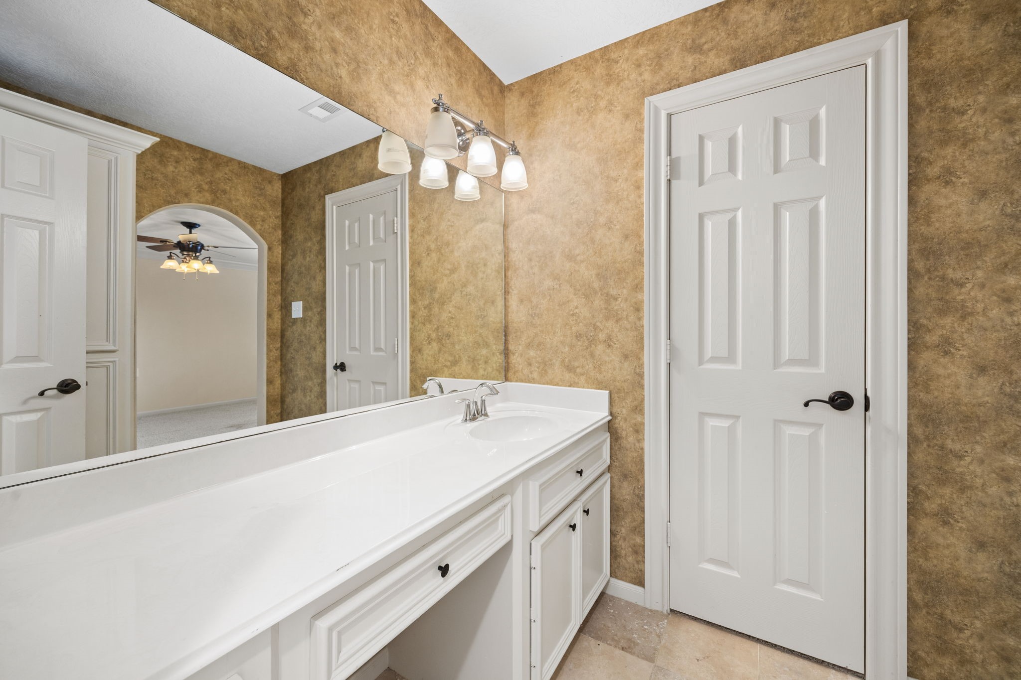 18921 Mountain Spring Drive Spring, TX 77379 - Photo 36 of 40 a bathroom with a sink a mirror and a shower