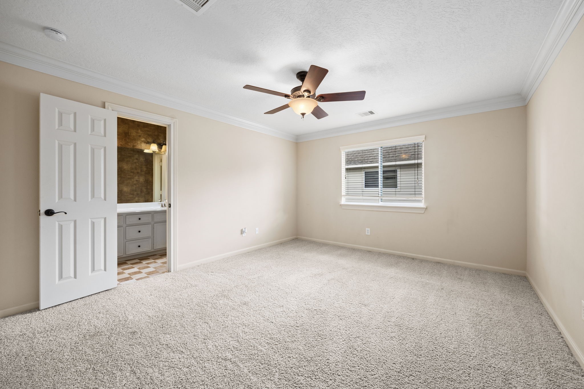 18921 Mountain Spring Drive Spring, TX 77379 - Photo 37 of 40 an empty room with windows and a ceiling fan