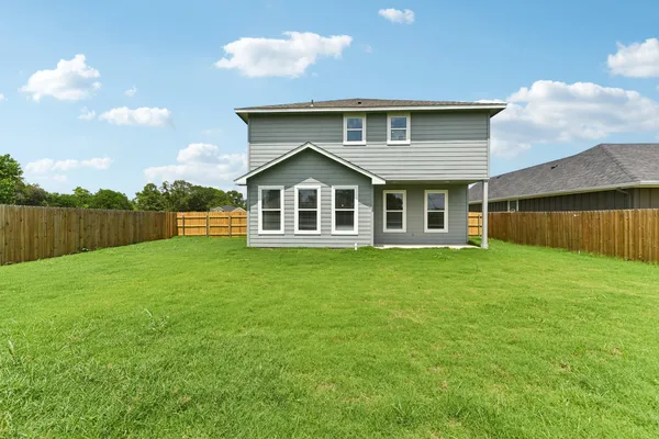 a front view of a house with yard