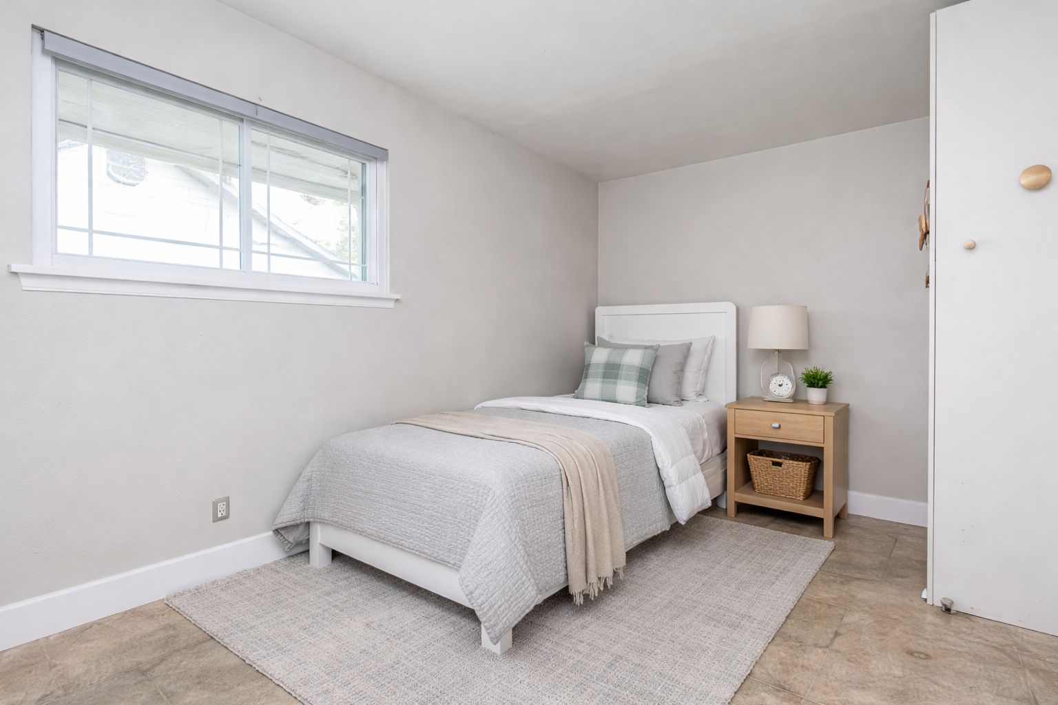 9506 Mountain Quail Road Austin, TX 78758 - Photo 12 of 19 Middle bedroom has a spacious built-in closet, and previously was used as a nursery / young child's room