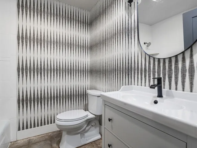 a bathroom with a sink and a toilet