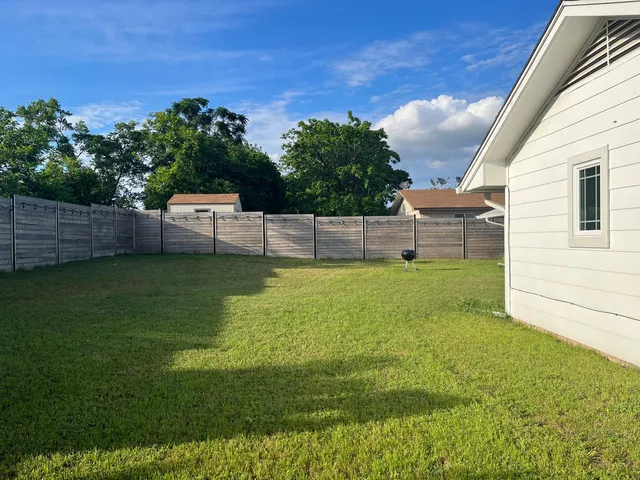 a view of a backyard with a garden and plants