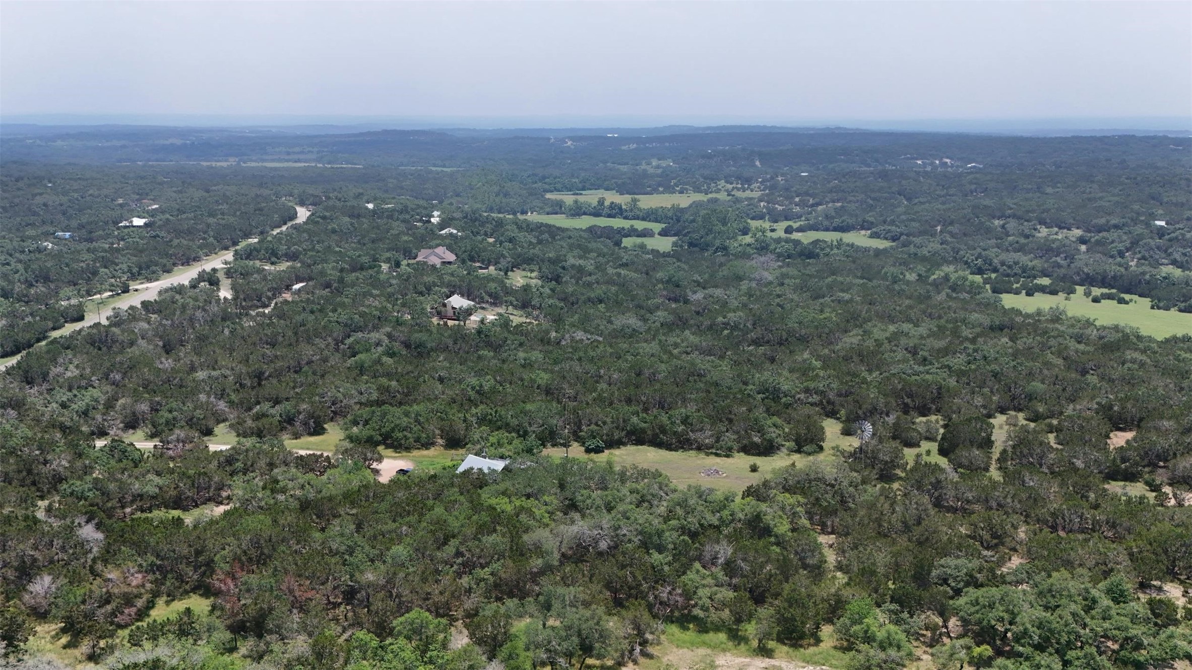 844 Plainview Road Wimberley, TX 78676 - Photo 9 of 10 an aerial view of house with yard and mountain view in back