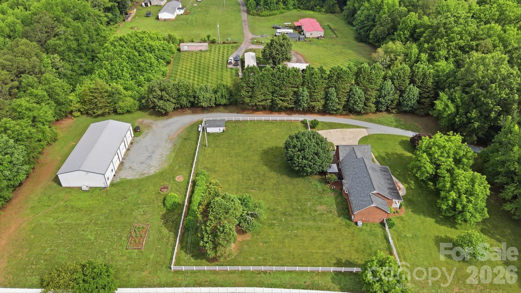 4017 Mullis Newsome Road Monroe, NC 28110 - Photo 5 of 38 a view of a golf course with a garden
