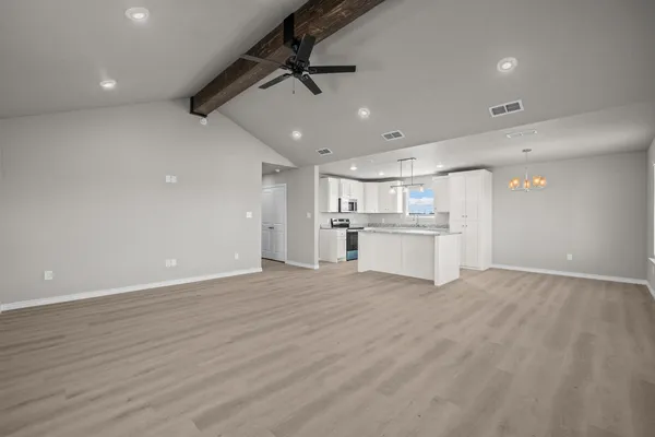 a view of a kitchen with a dishwasher and a refrigerator