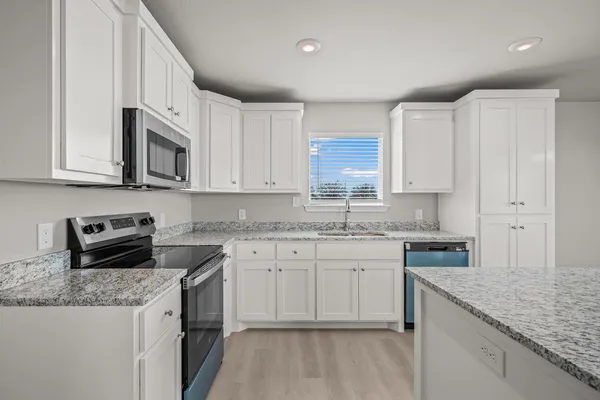 a view of kitchen with wooden floor