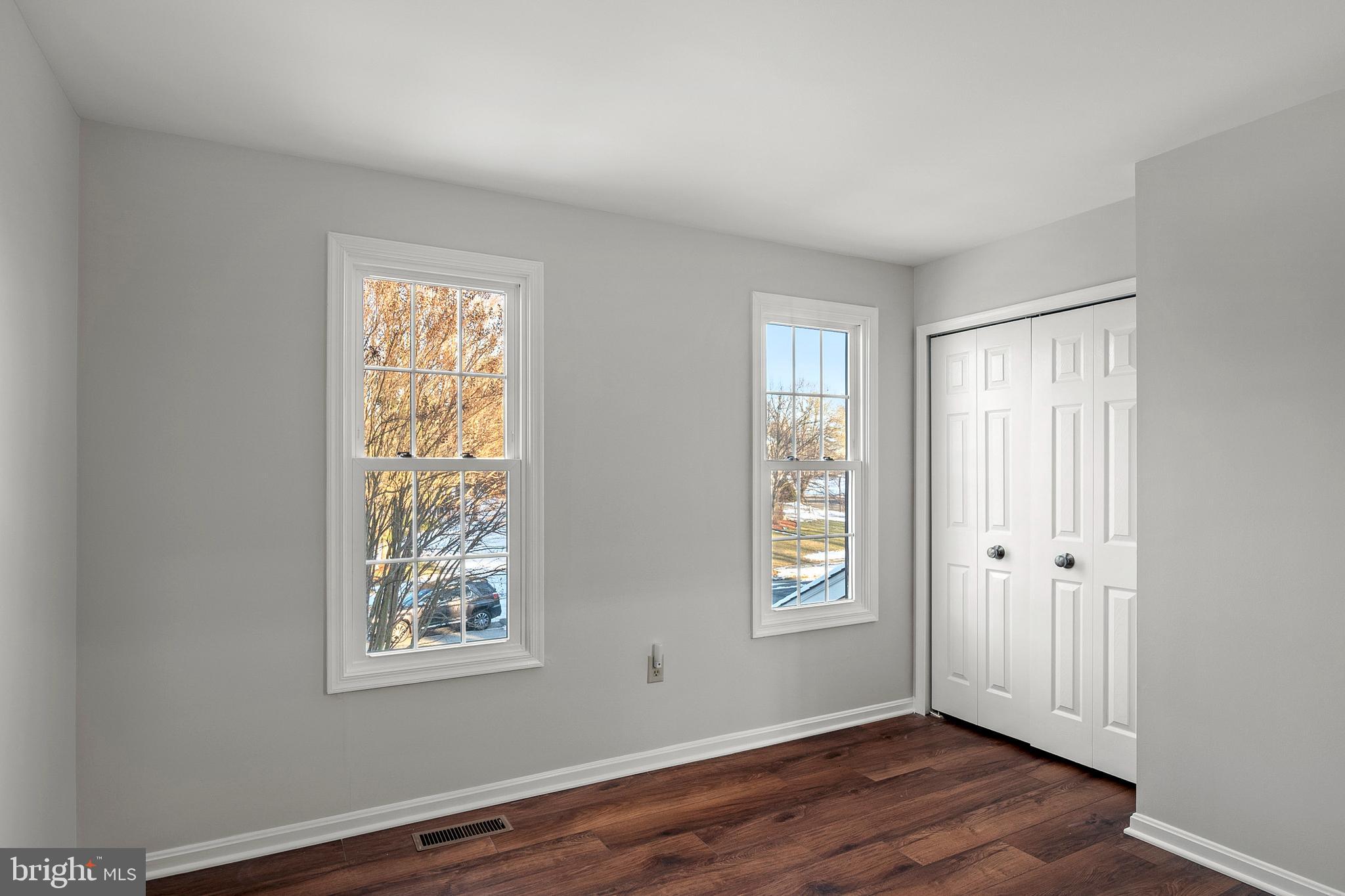 1508 Fairlakes Place Bowie, MD 20721 - Photo 27 of 51 a view of an empty room with wooden floor and a window