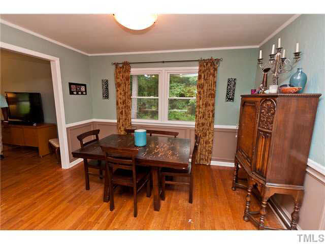 1530 Clermont Road Durham, NC 27713 - Photo 4 of 12 a workspace with furniture and wooden floor