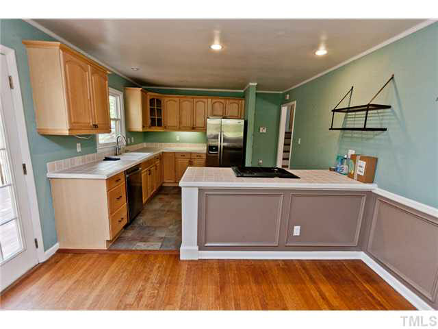 1530 Clermont Road Durham, NC 27713 - Photo 5 of 12 a view of kitchen with cabinets and wooden floor