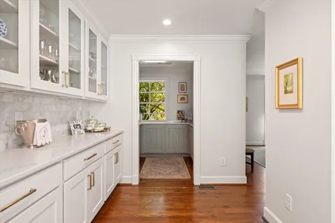 a spacious bathroom with stainless steel appliances granite countertop a sink and cabinets